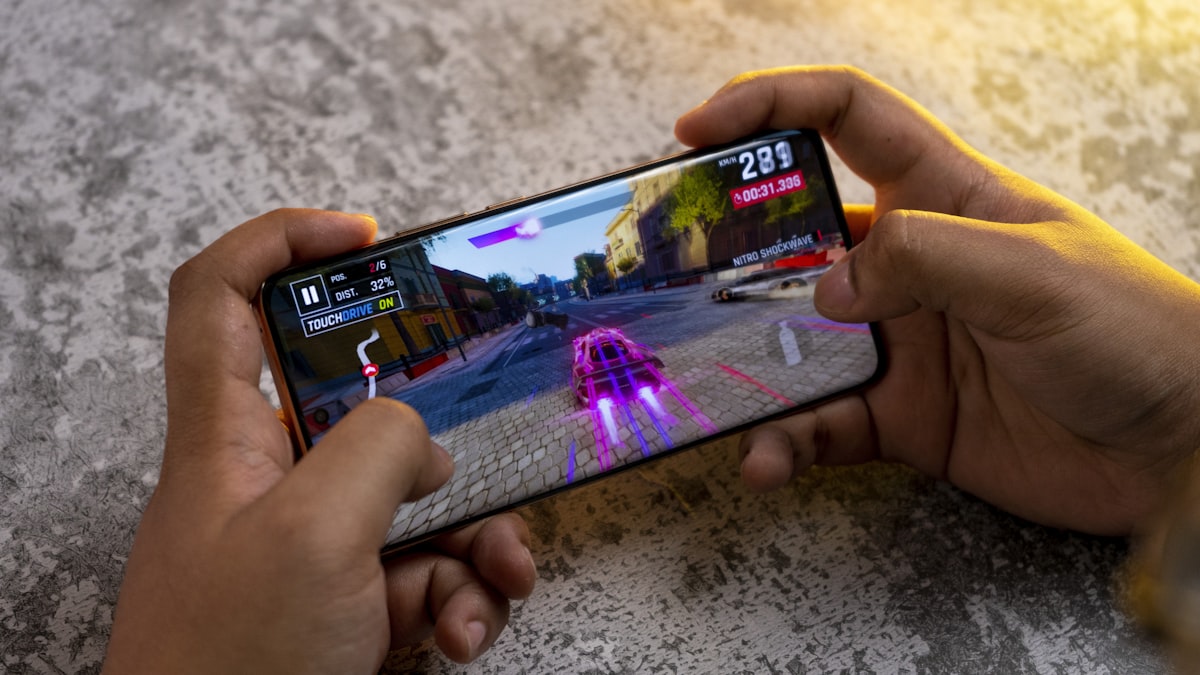 Person playing a mobile game on a phone outdoors